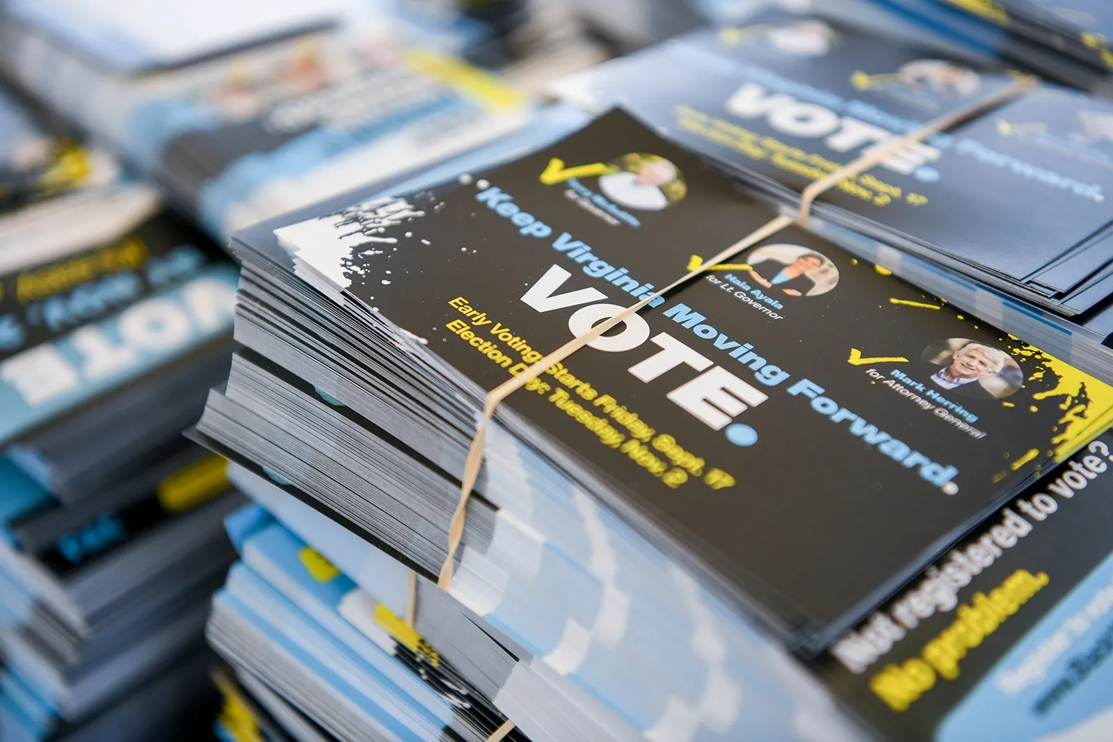 Stacks of BlackPAC voter mailers that read VOTE