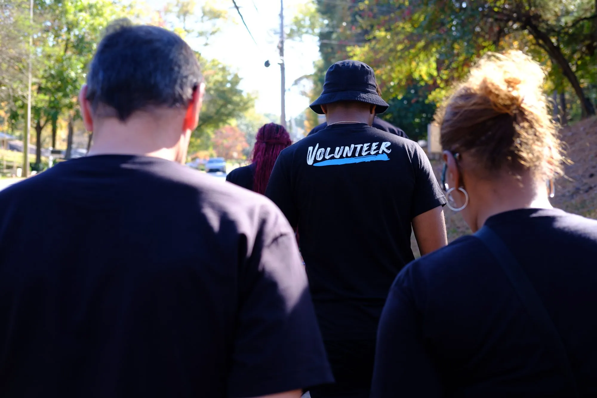 BlackPAC volunteers walking together down a neighborhood street